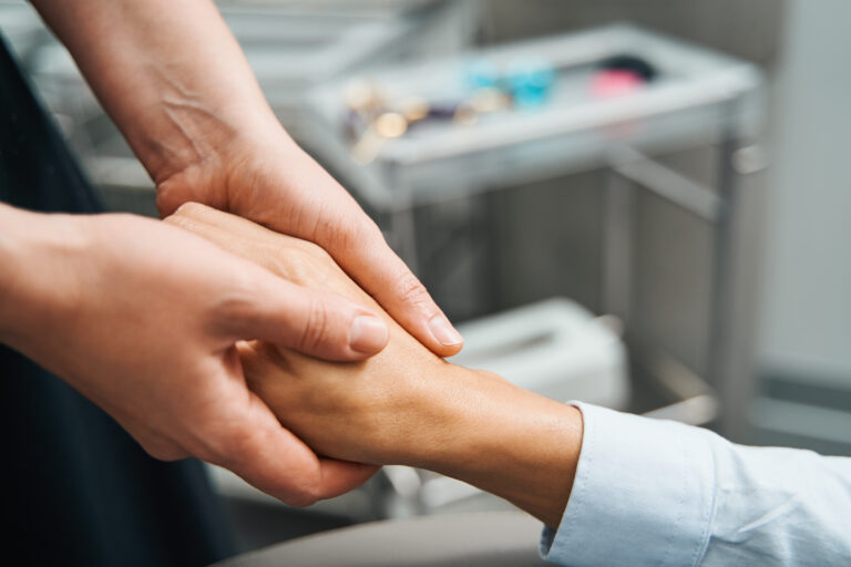Beauty therapist performing a rejuvenation procedure on her client skin