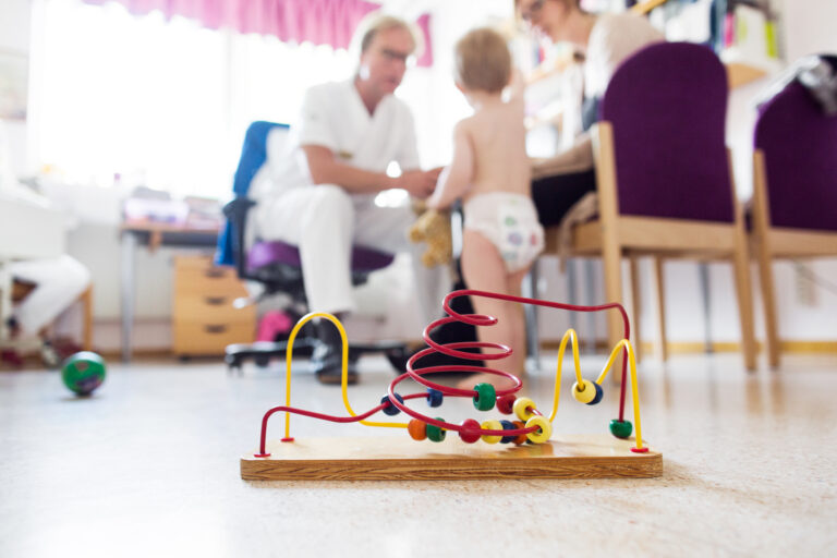 Doctor examining baby (12-17 months)