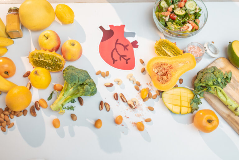 Human heart drawing and healthy fresh food on the table